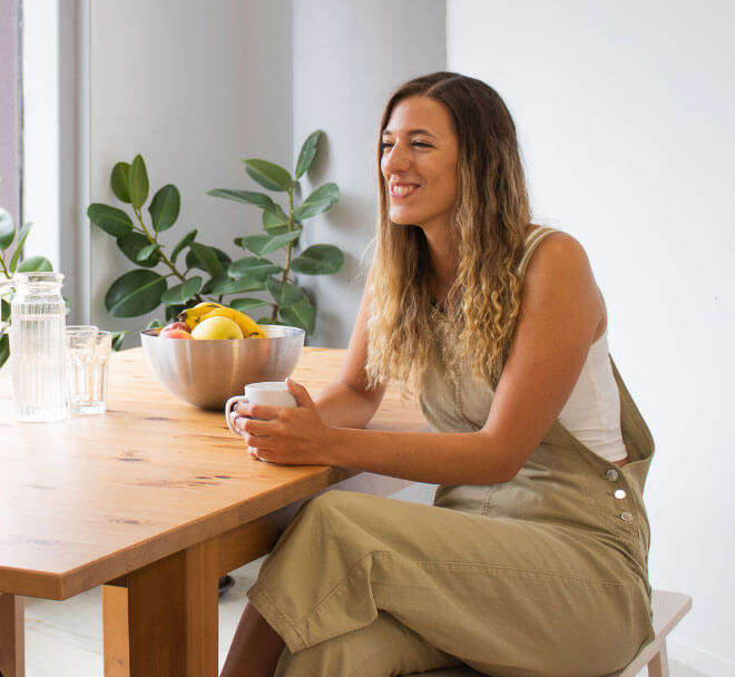 woman with coffee smiling